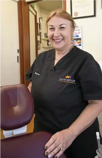  ?? PHOTO: KEVIN FARMER ?? LONG HAUL: Practice manager Karyn Iseppi has worked in various positions at David Mullins Orthodonis­t over 40 years.