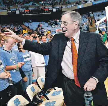  ?? Grant Halverson Getty Images ?? BRENT MUSBURGER, greeting spectators at a North Carolina basketball game in 2011, says he’ll miss the people he has “met along the trail” of a long career in broadcasti­ng, which ends Tuesday.