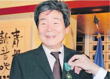  ?? THE ASSOCIATED PRESS ?? Isao Takahata, co-founder of Studio Ghibli, is awarded Officer of the French Order of Arts and Letters in Tokyo in 2015.