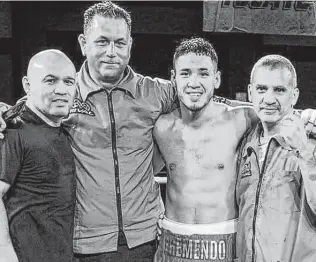  ?? Photos courtesy Leija family ?? “Jesse” James Leija, from left, cutman Johnny Leija — James’ cousin — local fighter Kendo Castaneda and trainer Joe Rodriguez are all smiles after a recent fight.