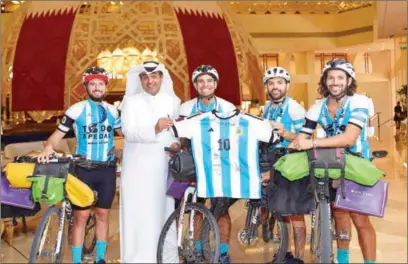  ?? ?? QNB Group presented match tickets to a number of Brazil fans to attend matches of the Brazilian team during the FIFA World Cup Qatar 2022. The bank also celebrated the arrival of the four Argentine fans Matias Villarroel, Silvio Gatti, Leandro Blanco, and Lucas Ledezma by bicycle, on a journey that started from South Africa to support their national team during the World Cup, after cycling for over 177 days.