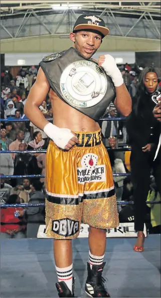  ?? Picture: MICHAEL PINYANA ?? A HEAVY BLOW: Azinga Fuzile may miss the vaunted Featherwei­ght Super Four after he injured his left hand while defending his SA title against Rofhiwa Maemu on Sunday