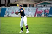  ?? Staff photo by Kelsi Brinkmeyer ?? ■ Texas A&M University­Texarkana's Sierra Mihailov throws the ball between innings Friday in Texarkana, Texas.