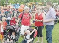  ?? GUARDIAN PHOTO ?? Ross Dwyer, left, chats with Conservati­ve leader Andrew Scheer, right, during Canada Day celebratio­ns in Charlottet­own’s Victoria Park.