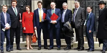  ??  ?? Lib Dem line-up: From left, David Laws, Danny Alexander, Jo Swinson, Nick Clegg, Ed Davey, Don Foster, Alistair Carmichael, Simon Wright and Vince Cable pose outside 10 Downing Street yesterday