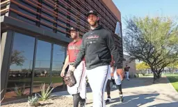  ??  ?? Diamondbac­ks pitcher Madison Bumgarner arrives for the first day of spring workouts Wednesday. He signed a 5-year, $85 million contract in the offseason.