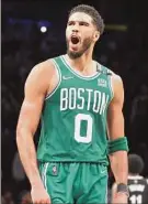  ?? Al Bello / Getty Images ?? Jayson Tatum of the Celtics celebrates Boston’s victory over Brooklyn in Game 3 of their series on Saturday. Tatum had 39 points.