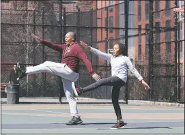  ?? (File Photo/AP/Kathy Willens) ?? Fred Frazer, a property manager, exercises in March 2020 with his daughter Olivia, 10, on the Christophe­r “Biggie” Wallace basketball courts in the Brooklyn borough of New York.