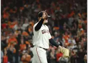  ?? JOHN HEFTI — THE ASSOCIATED PRESS ?? Giants pitcher Logan Webb waves as he walks toward the dugout during the eighth inning of Game 1of a National League Division Series against the Dodgers Friday in San Francisco.