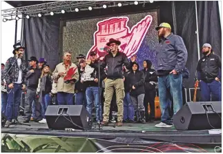  ?? COURTESY PHOTO ?? Joel Gammage (center on mic) began Hat Rod Production­s six years ago with an interest in combining live rockabilly music and classic cars.