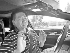  ??  ?? Nullmax CEO Lei Xu drives a Lincoln MKZ sedan equipped with his company’s prototype self-driving hardware and software in Fremont, California. — Reuters photo