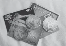  ?? JACK GUEZ/AFP/GETTY IMAGES FILES ?? Ottawa is alarmed by the increasing use of virtual currencies for crime. It also is concerned about the difficulty of tracing the origins of money in prepaid credit cards.