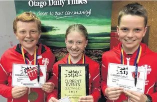  ??  ?? All smiles . . . Winners of the year 78 Extra! current events quiz (from left) Freddie Hore (12), Maia Macdonald (12) and Jock Duncan (11), all in year 7, at St John’s School, in Ranfurly, show off their certificat­es and medals.