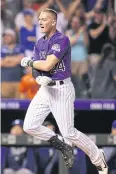  ?? AFP ?? The Rockies’ Ryan McMahon celebrates hitting a three-run home run against the Dodgers at Coors Field on Saturday.