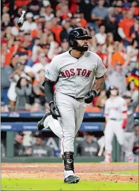  ?? DAVID J. PHILLIP/AP PHOTO ?? Jackie Bradley Jr. of the Boston Red Sox flips his bat as he watches his grand slam against the Houston Astros during the eighth inning in Game 3 of the American League Championsh­ip Series on Tuesday at Houston. The Red Sox won 8-2.