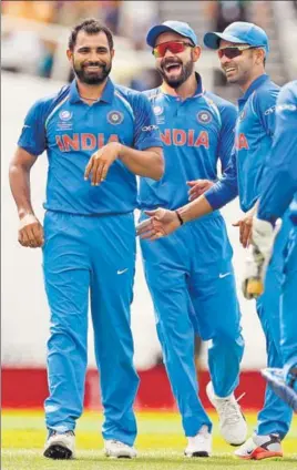  ??  ?? Making an India comeback, Mohammed Shami (left) was the pick of the bowlers in the warmup game against New Zealand at the Oval on Sunday. The pacer claimed three wickets.