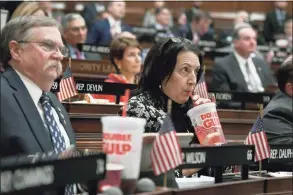  ?? Jessica Hill / Associated Press ?? In this Feb. 20, 2019, file photo, state Rep. Anne Dauphinais R-Killingly, takes a sip from a soda as Gov. Ned Lamont delivers his budget address at the State Capitol in Hartford.