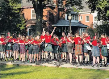  ??  ?? Concerts Members of the Ayrshire Fiddle Orchestra during their 2017 American tour