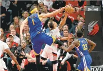  ?? RAY CHAVEZ/STAFF ?? The Warriors’ JaVale McGee blocks a shot against the Portland Trail Blazers’ Shabazz Napier in Game 4. The Warriors won 128-103.