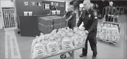  ??  ?? ■ U.S. RESIDENTS CASH IN: It’s like a modern day Gold Rush. Everyone’s scrambling to get their hands on the heavy, Jumbo Silver Ballistic Bags pictured above before they’re all gone. That’s because residents who find the first 2 digits of their zip code printed in today’s publicatio­n are cashing in on the lowest ever State Minimum price set for the next 2 days by the Federated Mint.