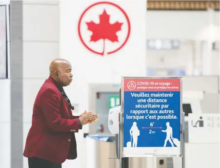  ?? NATHAN DENETTE/ THE CANADIAN PRESS ?? A man uses hand sanitizer at Pearson Internatio­nal Airport in the Toronto area on Wednesday. Air Canada CEO Calin Rovinescu says the federal government’s wage subsidy will help the airline “keep as many of our employees as possible during the crisis.”