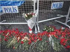  ?? — AFP ?? ISTANBUL: This file photo shows flowers laid in front of the Reina night club, in Istanbul, one day after a gunman killed 39 people, including many foreigners, in a rampage at an up market nightclub in Istanbul where revelers were celebratin­g the New...