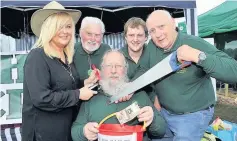  ??  ?? Before Perthshire Woodcrafte­rs member Bill Ellis had his head and beard shaved in aid of Age Scotland and Heartstart. Pam Sinclair, left, is pictured with Jack Coburn, Matthew Gorrie and Mike Nairn
