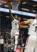  ?? RICH PEDRONCELL­I, THE ASSOCIATED PRESS ?? Raptors’ DeMar DeRozan goes for two Sunday in a 102-87 Toronto win.