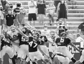  ?? SAM CRAFT/AP ?? Texas A&M place kicker Seth Small (47) kicks a field goal against Florida as fans cheer Oct. 10 in College Station, Texas.