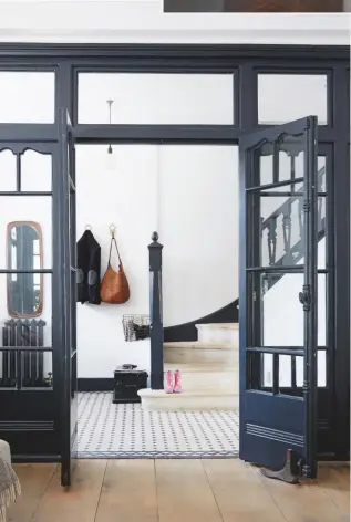  ??  ?? Project details this elegant glazed partition is proof enough that a door can be much more than just part of the bones of a room. the painted wood gives a crittall-style look to these edwardian doors and separates two areas while retaining a sense of unity without compromisi­ng on the light. Black oak Builders can make something similar from around £7,500.