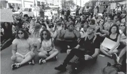  ?? | VIRGINIA BARREDA / SUN-TIMES ?? Protesters gathered Saturday at Millennium Park.