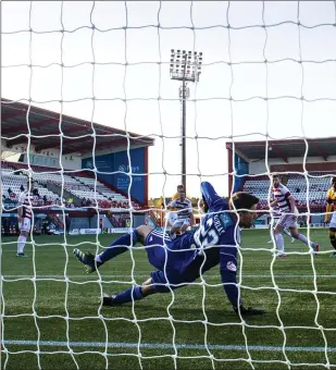  ??  ?? Hamilton goalkeeper Kyle Gourley watches on as Motherwell’s Mark O’Hara scores the only goal of the game