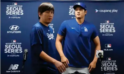  ?? Photograph: Lee Jin-man/AP ?? The Los Angeles Dodgers' Shohei Ohtani, right, and his former interprete­r, Ippei Mizuhara, were close friends before allegation of theft arose.