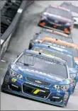  ?? Brian Lawdermilk/Getty Images ?? Jimmie Johnson, leads a pack of cars Monday in Bristol, Tenn.