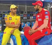  ?? — IPL ?? CSK skipper M.S. Dhoni talks to Punjab Kings youngster Sharukh Khan after their match on Friday.