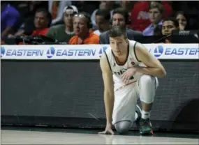  ?? WILFREDO LEE — THE ASSOCIATED PRESS ?? Miami guard Dejan Vasiljevic waits to enter the game against Western Carolina on Nov. 11. Vasiljevic was born in Canada, grew up in Australia with Serbian roots and is now finding a home as a shooting guard for the Hurricanes.