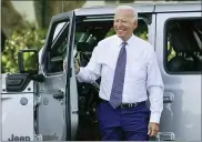  ?? SUSAN WALSH — THE ASSOCIATED PRESS ?? President Joe Biden smiles after driving a Jeep Wrangler 4xe Rubicon on the South Lawn of the White House in Washington Thursday, during an event on clean cars and trucks.