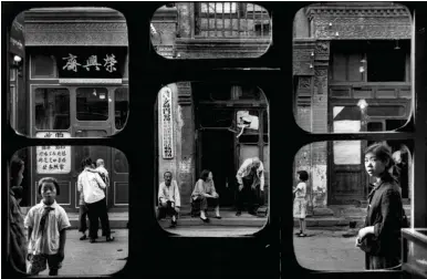  ??  ?? Street view from inside an antique dealer’s shop, Beijing, 1965; photograph by Marc Riboud