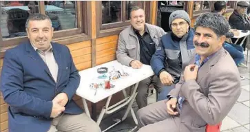 ?? Roy Gutman For The Times ?? KEMAL KOK, left, Turan Sariboga, right, and other customers at a teahouse in Sivrihisar were surprising­ly well informed despite a government crackdown on the news media, and they had plenty to say.