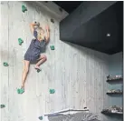  ??  ?? A kids’ climbing wall leads to a small mezzanine area just below the bedroom’s high ceiling. “Good architectu­re can still be playful and fun,” architect Jack McKinney says.