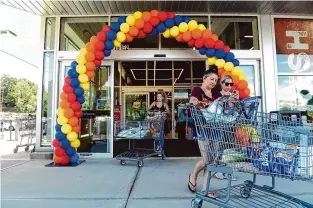  ?? Arnold Gold/Hearst Connecticu­t Media ?? Rene King, right, and Brianna Kinney, far right, of East Haven, exit the newly opened Aldi grocery store in Branford on June 23, 2022.