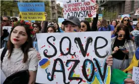  ?? Photograph: Sergei Chuzavkov/SOPA Images/REX/Shuttersto­ck ?? Activists and relatives of soldiers trapped in Mariupol protest in Kyiv calling on the Ukrainian government for help.