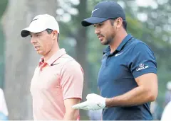  ?? AFP ?? Rory McIlroy, left, and Jason Day at a PGA tournament last year.