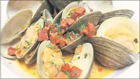  ?? PORTA BLU ?? Porta Blu’s Mediterran­ean influence is seen in this entree of ameijoas na cataplana, Portuguese-style clams with ham, chorizo and tomatoes.