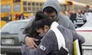  ??  ?? Becky Galvan, center, consoles her daughter, Ashley Galvan, with her father, Jose Chavez, outside Waukesha South high school on Monday. Photograph: Mike De