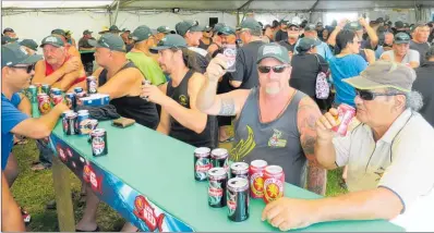  ??  ?? CHEERS: Shadow Greer and Matt Walters enjoy a beverage and each other’s company in the beer tent at the end of another prizegivin­g event during last week’s Snapper Bonanza surfcastin­g extravanga­za.