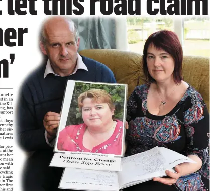  ?? Photo by Michelle Cooper Galvin ?? Suzanne and Anthony Dennehy, Fossa, holding a photo of Annette Mannix and their petition for road safety which includes over 450 signatures to date.