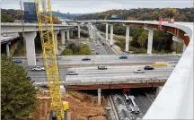  ?? PHIL SKINNER / AJC ?? The most expensive highway constructi­on project in Georgia history — the Northwest Corridor Express Lanes in Cobb and Cherokee counties — is near completion.