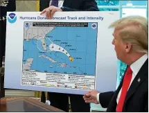  ?? CHIP SOMODEVILL­A — GETTY IMAGES ?? President Donald Trump on Sept. 4reference­s a map from Aug. 29showing Hurricane Dorian’s projected path. The map was altered by a black marker.