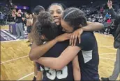  ?? Luca Evans Los Angeles Times ?? JACKIE POLK is surrounded by teammates after leading Rancho Cucamonga Los Osos to a title.